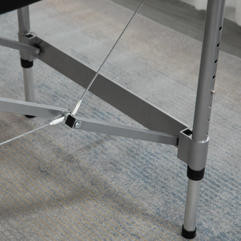 Portable Massage Table Featuring a Face Hole, Arm Supports, Hand Rests, And Dimensions of 186 Cm X 71 Cm X 83 Cm.