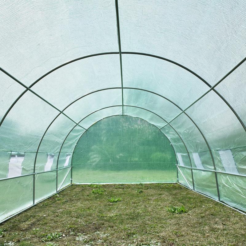 Heavy Duty Greenhouse with Arched Design & Window - Large 595x300x200cm (19.5x9.8x6.6ft) Outdoor Plant Insulation Room, Durable Plastic Construction with Sturdy Frame, All-Weather Protection, Ventilation System & Shelving Com