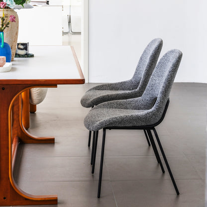 A Pair of Light Gray Dining Chairs Featuring Openwork Backs And Metal Structures.