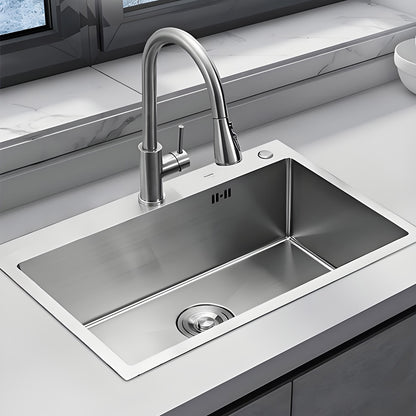 Large stainless steel sink with single basin in Silvery color, featuring a pull-out faucet and drain basket, measuring 80x50cm, complete with soap dispenser and drainage kit.